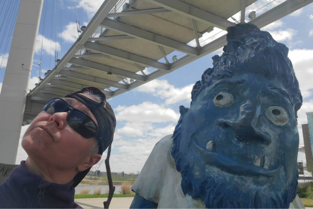 EG Orren with a blue troll under a bridge having fun